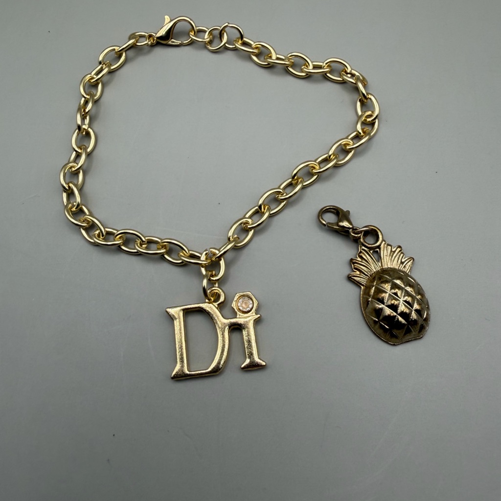 Diamonds International Gold Charm Bracelet With Pineapple Charm